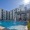 a pool in front of a white building