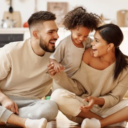 “Beautiful community... a family sitting on the floor smiling