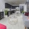 a living room with a fan and couches