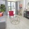 a living room with a glass balcony door and a couch and a table